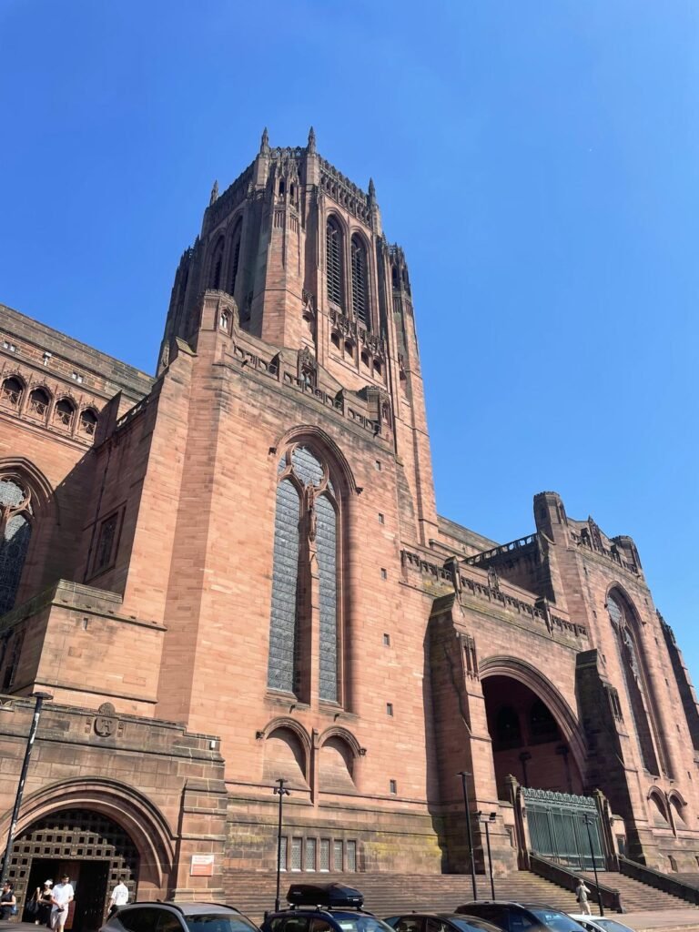 Liverpool Anglican Cathedral stands against a bright blue sky
